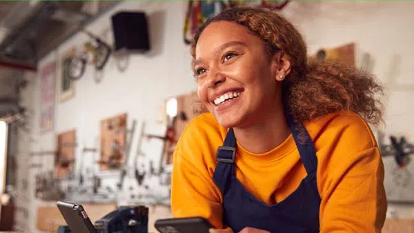 Female business owner smiling